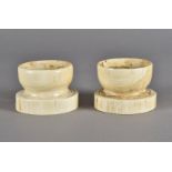 A pair of early 19th Century ivory trench salts, each with concentric circle marks to the base, 6.