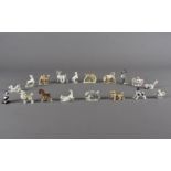 A collection of eighteen Wade and other miniature figures, including rabbits, squirrels, bull and