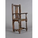 An apprentice made oak miniature carver chair, having bobbin front legs, beading to seat edges,