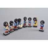 A eight piece Golly Band figure set, comprising drums, saxophone, singer, trumpet, bass, guitar,