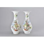 A pair of Victorian glass ovoid bottle vases, the white ground with hand painted floral decoration ,