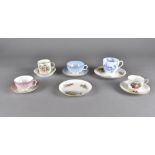 A small collection of cups and saucers, including a Staffordshire botanical painted trio, a Royal