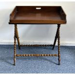 A Victorian and later butlers tray, having a turned walnut X frame stand and mahogany tray, AF, 74cm
