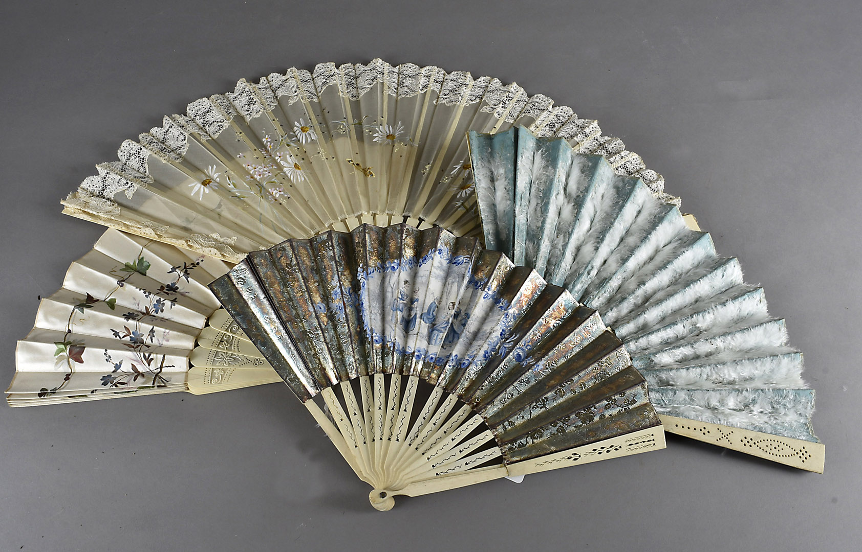 Five 19th Century continental bone fans, some with lace others with painted floral scenes