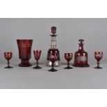 A 19th Century Bohemian cranberry glass faceted footed vase, with engraved design of horses, 17 cm