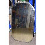 A 1930s wall mirror, the bevelled glass mirror having white metal frame with floral finial to top,