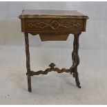A 19th Century continental walnut worktable, with quarter veneered top opening to reveal a fitted