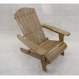 An Adirondack folding chair, in teak