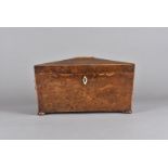 A Regency sarcophagus shaped burr walnut tea caddy, with bone escutcheon, gilt lion mask handles,