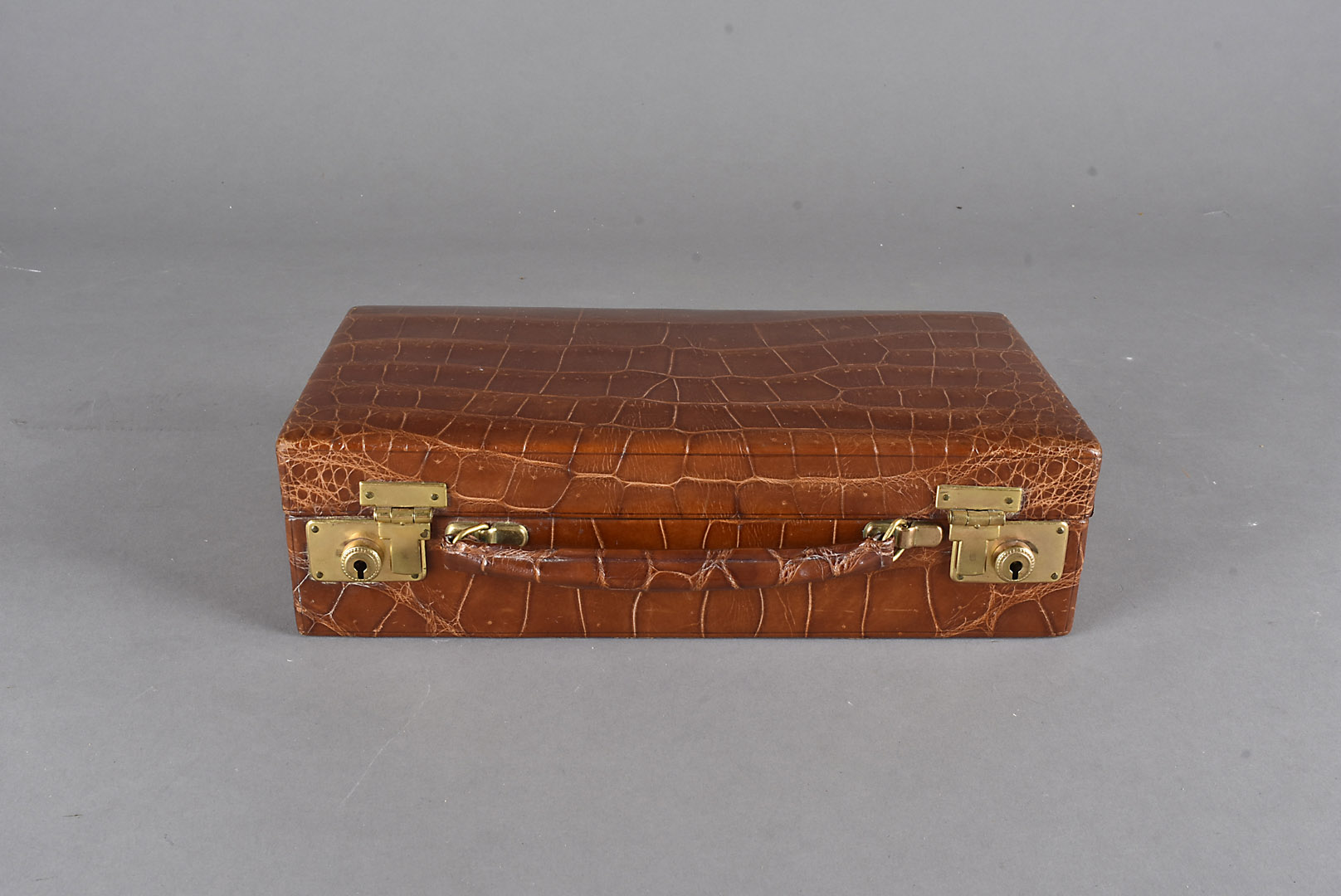 A J C Vickery of Regent Street crocodile skin and leather jewel case, with lacquered brass fittings,