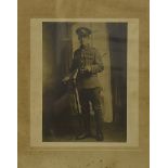 Three WWI black and white photographs, of large size, framed and glazed, depicting a machine gun