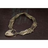 A Victorian 9ct gold gatelink bracelet, with heart shaped padlock clasp, 14.4g