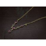 A pretty 9ct gold and tourmaline fringe necklace, the lower section with green and pink stones and