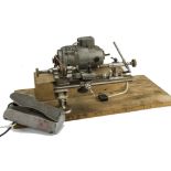 A 1970s watch makers or engineers lathe and die set, the Ideal 5000 rpm motor mounted on wooden