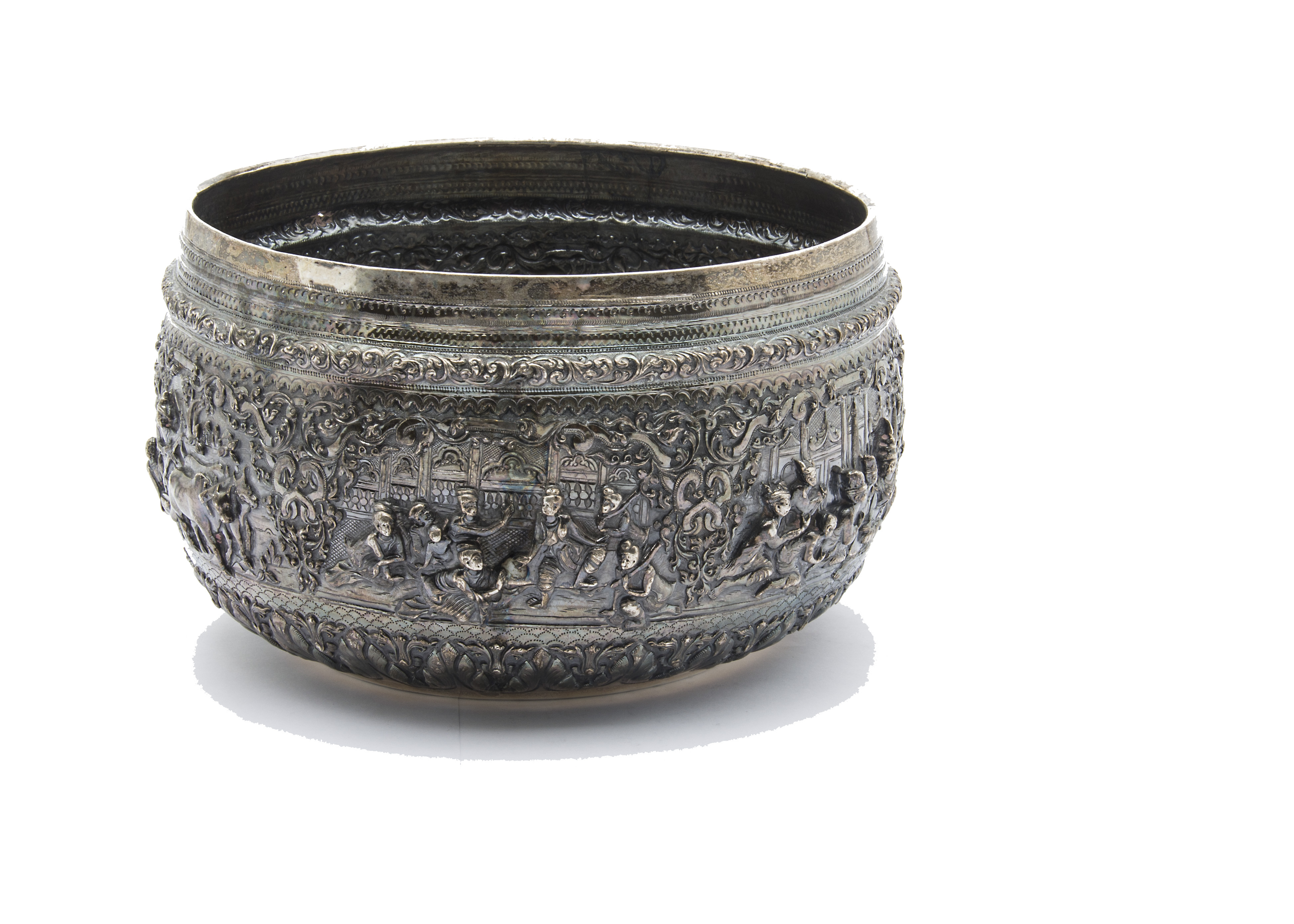 A large 19th century Indian silver bowl, having intricate embossed scenes of figures with ornate - Image 3 of 4