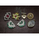 A small collection of mid 20th century jewellery, earrings, rings, brooches, and a charm bracelet