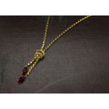 A vintage Middle or Far Eastern 14ct gold necklace, facet link chains with tie to lower and