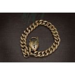 A Victorian 9ct gold bracelet, the hollow curb link chain with some engraved links, having heart