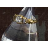 A Victorian diamond ring, the gold mount centred with a 0.62ct old cushion cut stone, lacking two