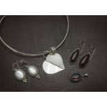 A good collection of silver and other jewellery, including a modern silver torsion necklace, several