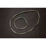 A fine associated 9ct gold and silver necklace from Furr & Co, each with 9ct gold collars and