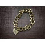 A heavy 9ct gold bracelet, with oval twist links, some hallmarked, united by a heart shaped