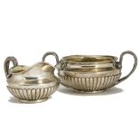 A George III silver sugar basin and milk jug by Rebecca Emes & Edward Barnard, fluted lowers with