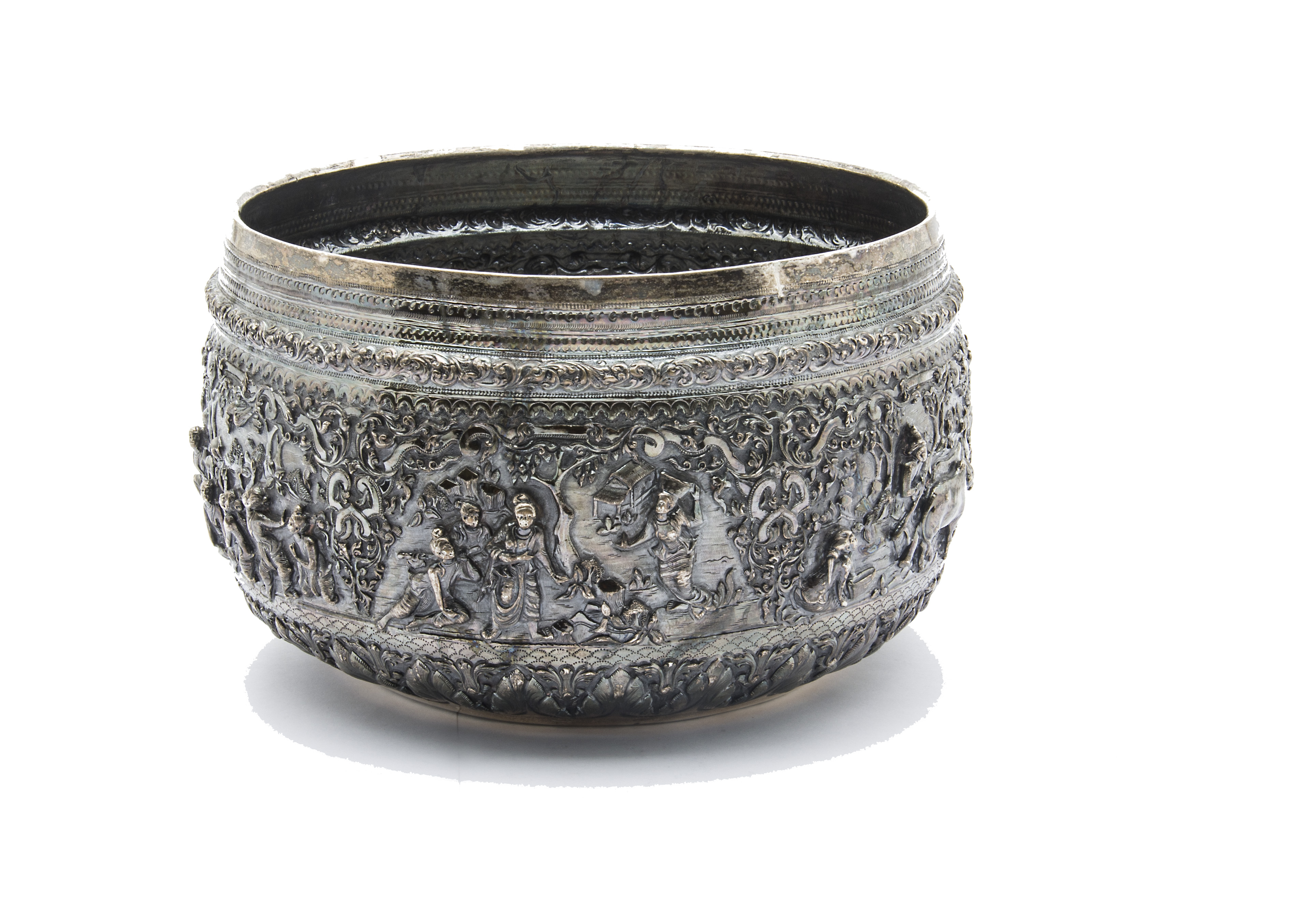 A large 19th century Indian silver bowl, having intricate embossed scenes of figures with ornate - Image 2 of 4