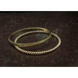 Two heavy gold bangles, both probably 9ct, one plain, the other of rope twist design, 50g (2)