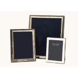 Three modern silver photograph frames, largest 29.5cm, medium 21cm, and smallest from Arthur