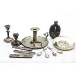 A group of silver and silver plate, including a Greek silver dish, two silver filled candlesholders,