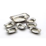 An Art Deco set of seven American silver dishes by Smith Peterson Co, comprising an octoganal larger