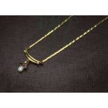 A 1980s 9ct gold and gem set necklace, flattened link centred with a pearl and red and clear stones,