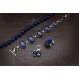 A modern group of lapis lazuli jewellery, including a bead necklace, a bracelet, a pair of