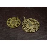 Two yellow metal Chinese pendants, each circular pierced pendant with Chinese symbol and marked