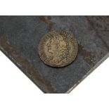 A 17th century style coin, circular brass token similar to a James II 1689 gun money coin