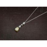 A modern and pretty diamond pendant on chain, having two navette shaped diamonds and small brilliant