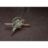 An Art Deco period paste set parrot brooch, the gold bar with hoop supporting a silver bird set with
