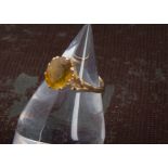 A 1970s gold and citrine solitaire dress ring, orange oval stone in possibly 14ct mount, 3.3g and