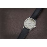 A 1980s Omega Seamaster quartz stainless steel wristwatch, with cream dial and date apeture, on