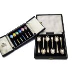 A set of six Art Deco silver and enamel coffee spoons from Garrard & Co, together with a set of