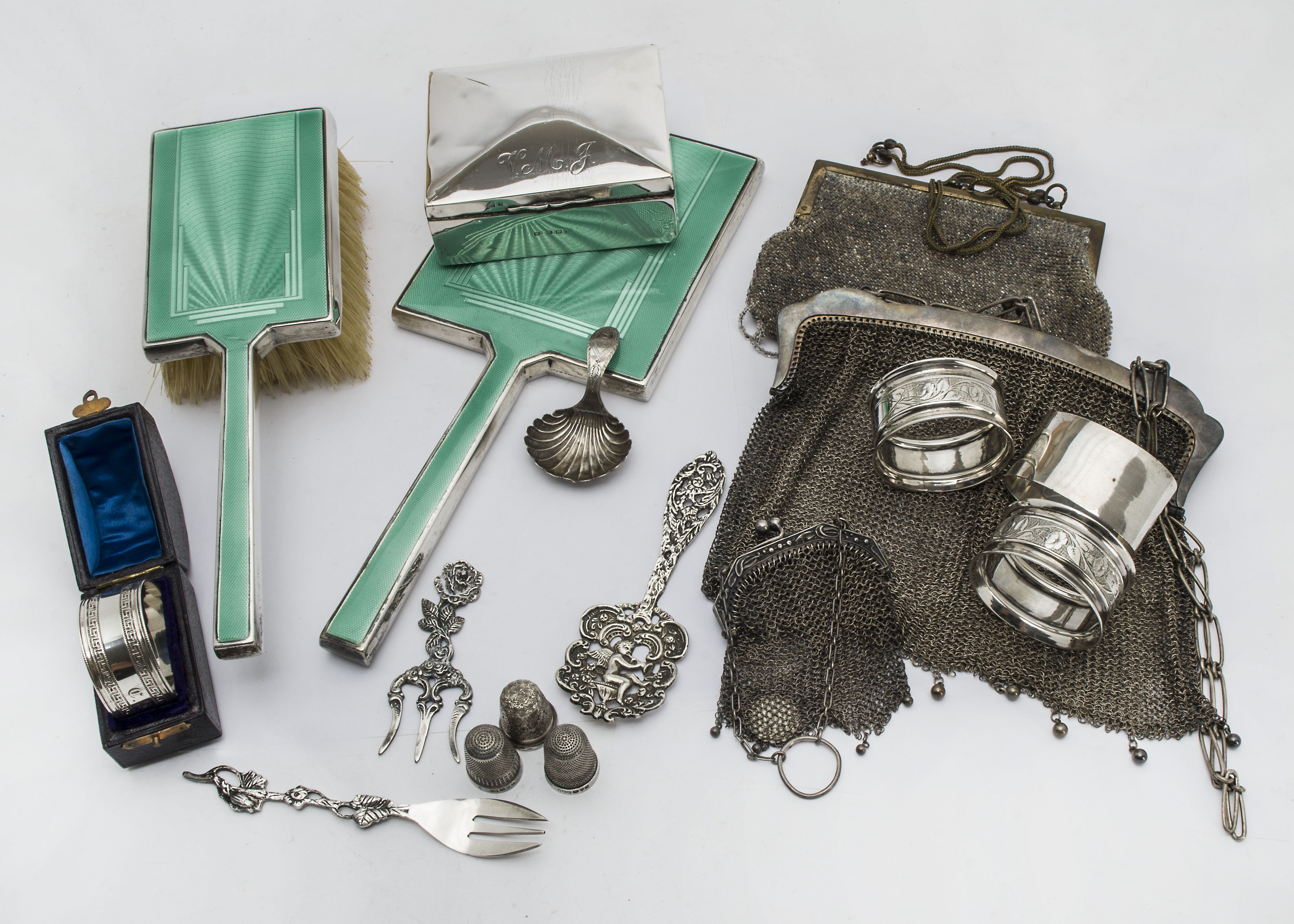 A collection of silver and other items, including an Art Deco silver and enamelled hand mirror and