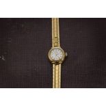 A 1960s 18ct gold Omega Ladymatic wristwatch, circular dial with integrated bracelet, appears to