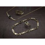 An associated suite of 9ct gold and sapphire jewellery, comprising ring, bracelet, necklace and