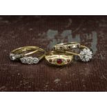 Five gold and gem set rings, including a nice 18ct gold and diamond cluster, an 18ct gold three