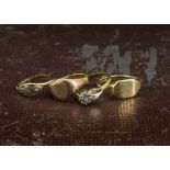 An 18ct gold signet ring, together with an 18ct gold and diamond solitaire ring, another signet ring