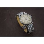 A 1940s Omega stainless steel gentleman's wristwatch, once luminous Arabic numerals to cream