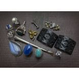 A small collection of jewellery, presented in an Italian Sorento style book puzzle trinket box,
