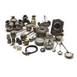 A collection of silver and white metal trinkets and curios, including a tri-form pot marked 800, a