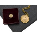 An Elizabeth II full sovereign in 9ct gold pendant mount, dated 1957, EF, but not inspected, with